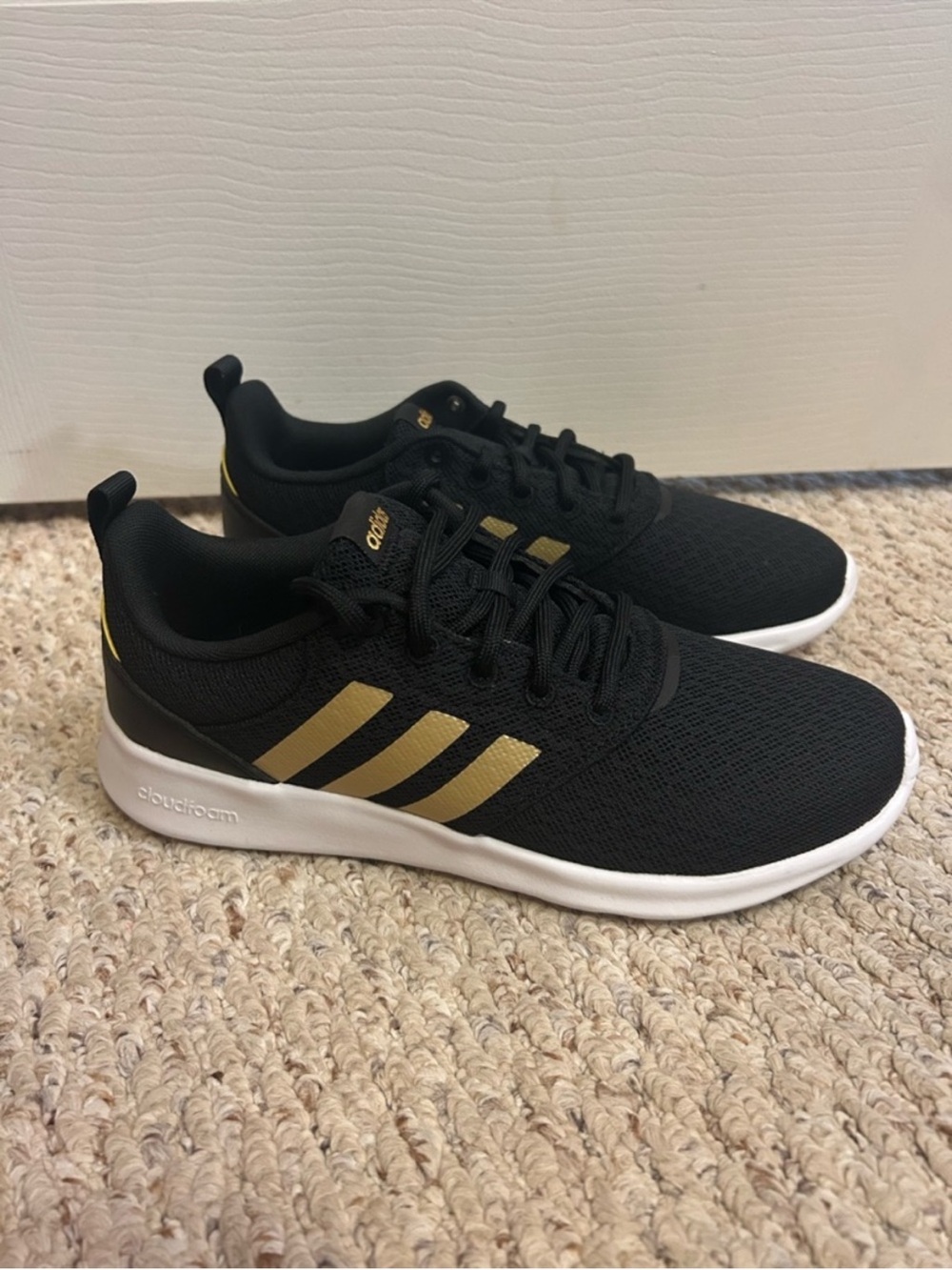 Adidas women’s Black & Gold Cloudfoam Lightweight Sneaker
